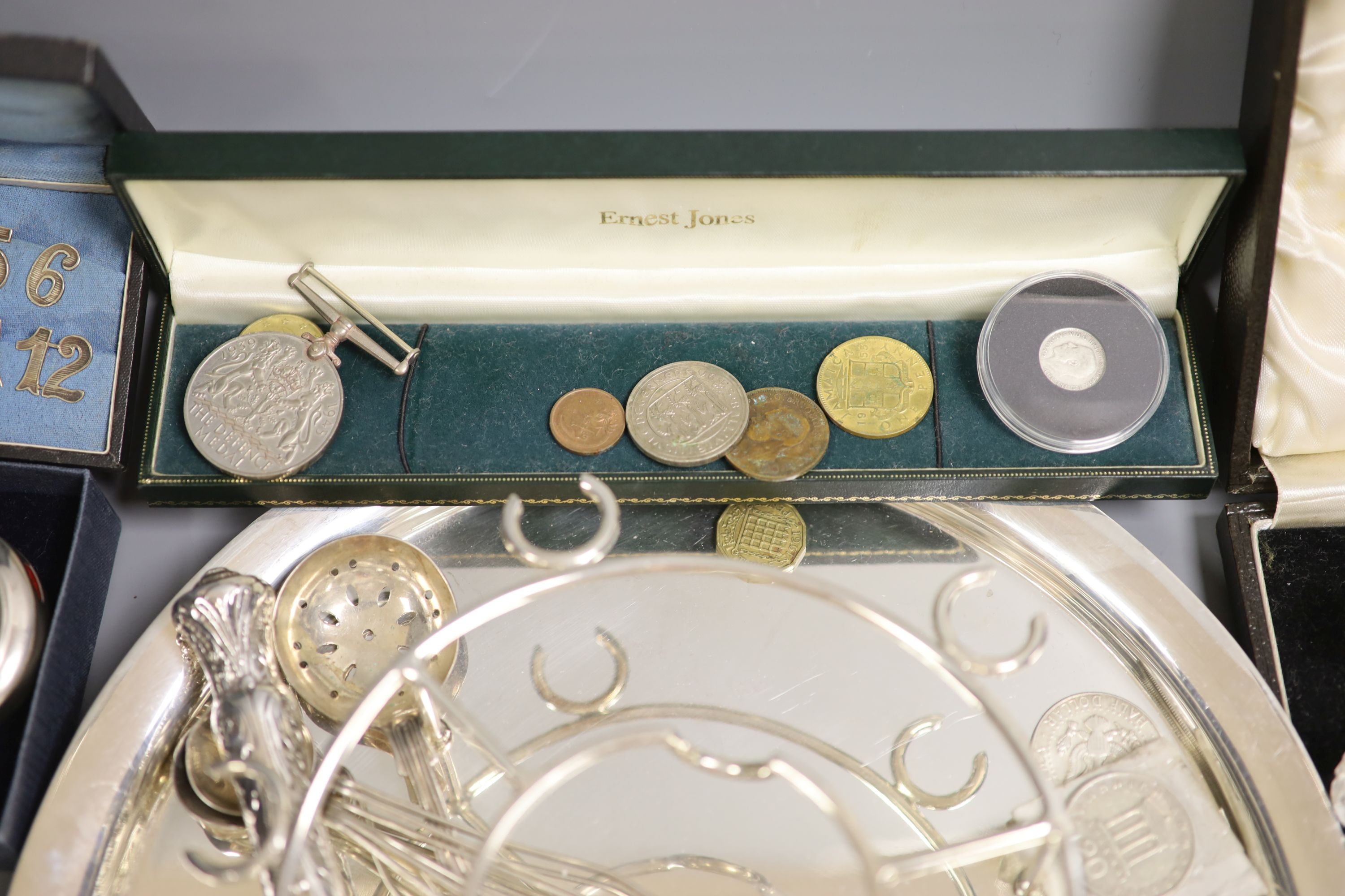 A plated silver stand, a fob watch, coins etc.